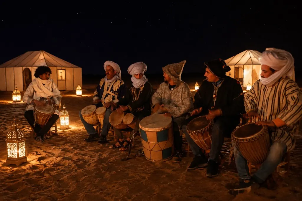 Berber musicians playing drums around lanterns in a desert camp under the stars