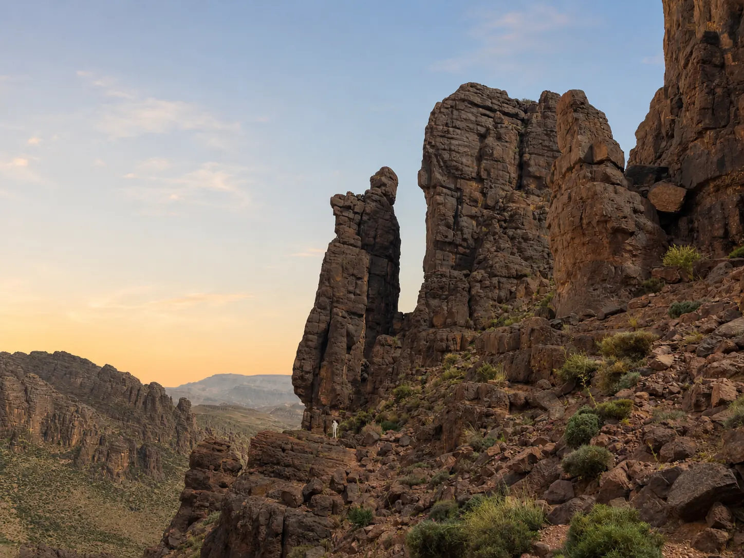 Dramatic volcanic rock spires of the Jbel Saghro massif at sunset