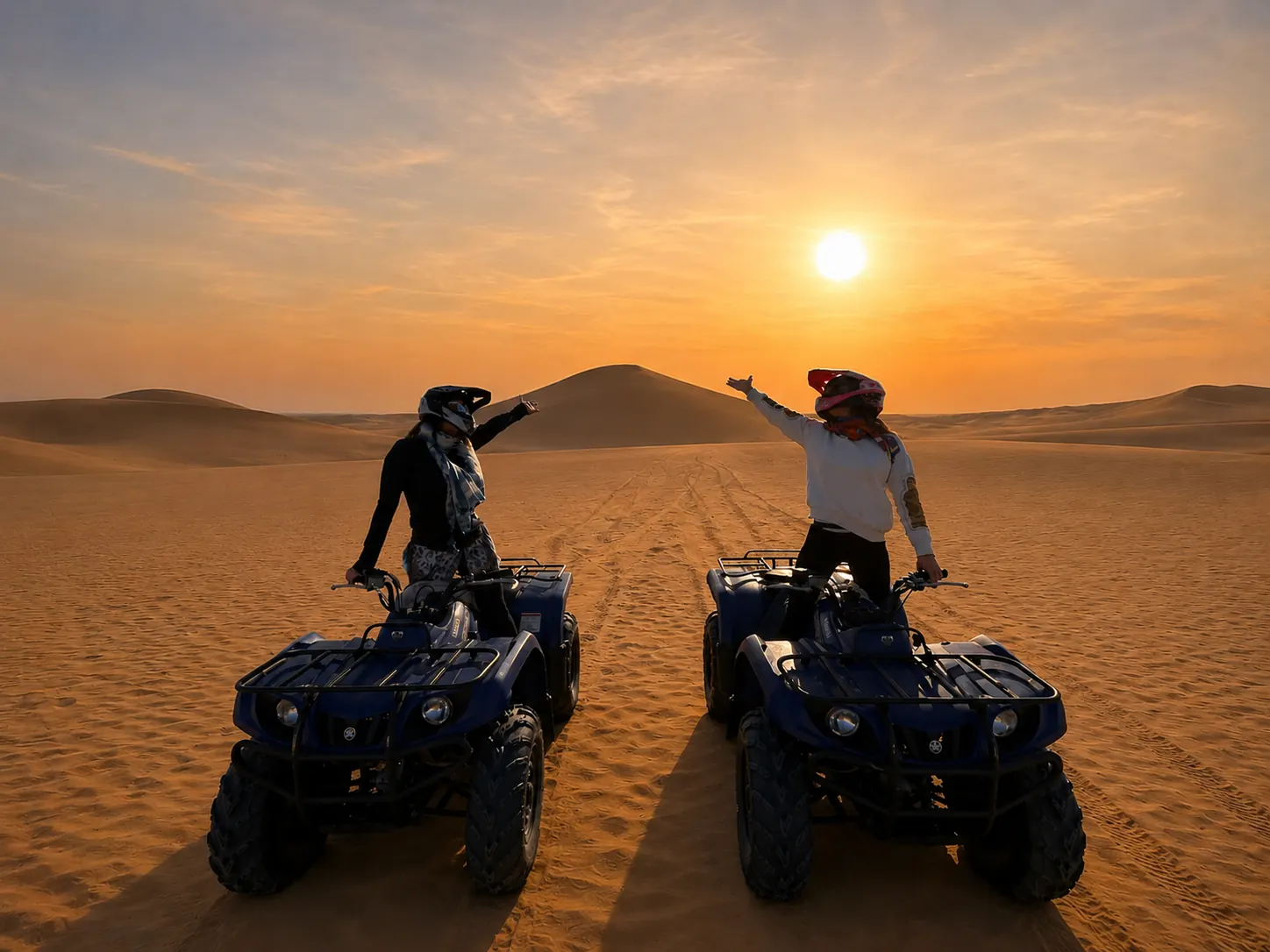 Two riders on quad bikes facing each other on the Agafay Desert at golden sunset